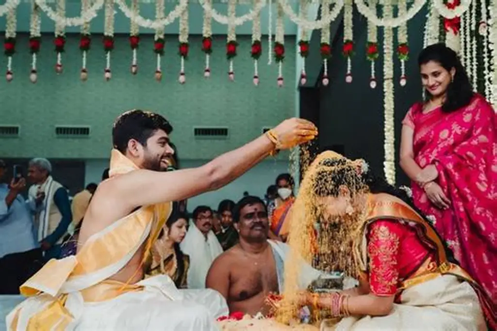 Candid couple moment captured using cultural Indian wedding photography style