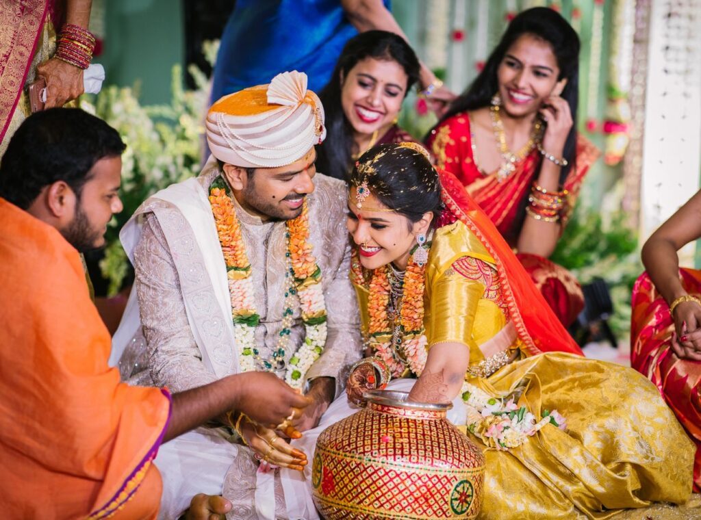A joyful Telugu couple captured beautifully during their wedding rituals with vibrant colors and emotions through Best Wedding Photography Hyderabad.